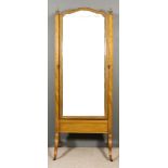 An Early 20th Century Mahogany Framed Cheval Mirror, the square uprights inlaid with stringings with