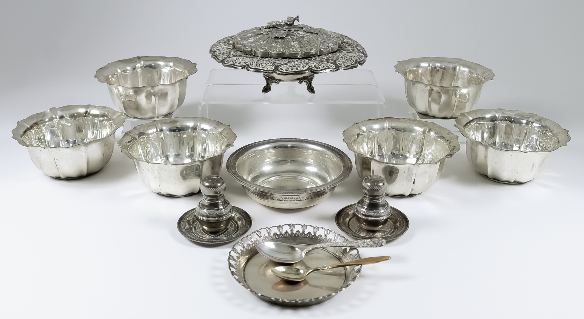 Six 20th Century Egyptian Silvery Metal Finger Bowls, with lobed bodies and shaped rims, 5ins