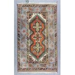 Two Turkish Rugs of Kazak Design, Modern, one woven in muted colours with three cross motif on a