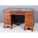 A Mahogany Kneehole Desk, with leather inset to top, fitted nine drawers, on bracket feet, 48ins