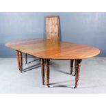 A 19th Century French Oak Oval Dropleaf Concertina Action Extending Dining Table, with six extra