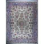 A Kirman Carpet, Mid 20th Century, woven in pinks, blues and other colours with central double