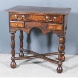 An Oak and Mahogany Banded Lowboy, with moulded edge to top, fitted on frieze drawer and two short