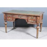 A Victorian Carved Oak Rectangular Writing Table, with green tooled leather inset to top, fitted