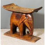 An Ashanti Carved Hardwood Elephant Stool, Early 20th Century, 24.75ins wide x 13.5ins deep x