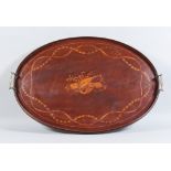 An Edwardian Inlaid Mahogany Oval Two-Handled Tray, inlaid with musical trophies to centre, ribbon