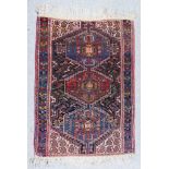 A Shivan Rug, Early 20th Century, woven in colours with a central pole medallion with three hooked