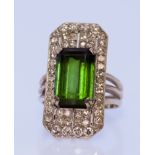 A Green Tourmaline and Diamond Shield Ring, Modern, in silvery metal mount, the centre tourmaline