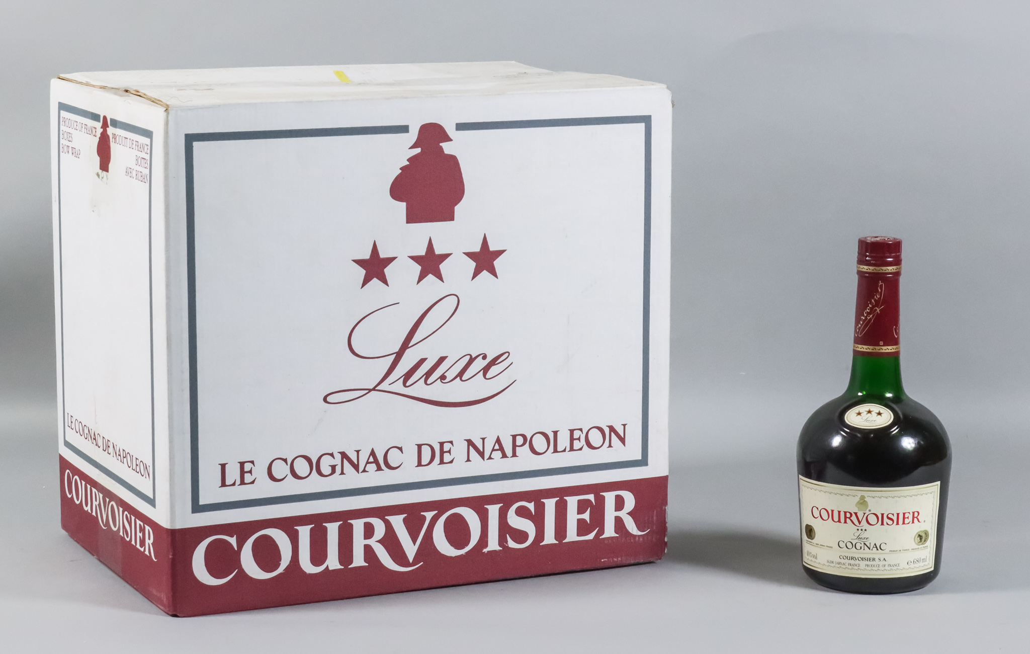 Twelve bottles of Courvoisier "3 Star" Cognac