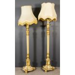 A Pair of Cream Painted and Gilt Candlestick Pattern Standard Lamps in the "Neo Classical" Manner,