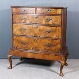 An 18th Century Walnut and Pine Sided Chest, the quarter veneered top inlaid with boxwood