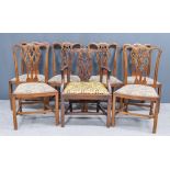 A George III Mahogany Armchair and a Set of Six Similar Mahogany Dining Chairs of "George III"