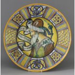 An Italian Maiolica Dish in the Deruta Style, Late 19th Century, the centre painted with the head of