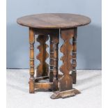 A Small Oak Oval Gateleg Occasional Table of "17th Century" Design, on shaped end supports and