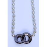 A String of Cultured Pearls, Modern, 450mm, with silvery metal hoop design to centre set with two