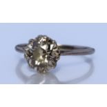 A Solitaire Diamond Ring, Modern, in white metal mount, set with a round brilliant cut diamond,