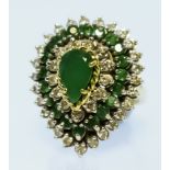 An Emerald and Diamond Cluster Ring, Modern, in 18ct gold mount, the centre set with emerald,