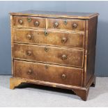 An 18th Century Walnut and Pine Sided Chest, the top with wide crossbanding, fitted two short and