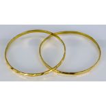 Two 22ct Stiff Bangles, Modern, total gross weight 28g