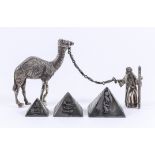 A Continental Cast Silvery Metal Model of a Camel and Handlers, and Three Silvery Metal Models of