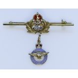 A 14ct Gold and Enamel Bar Brooch, in the form of the Royal Naval Cap insignia, 50mm x 15mm, and a