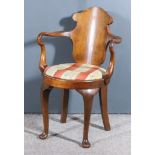 A Walnut Armchair of "18th Century" Design, with solid shaped back panel, shepherd's crook arms,