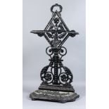 A Victorian black painted cast iron umbrella stand in the style of Christopher Dresser, by T.J.
