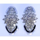 A Pair of Pavé Set Diamond Earrings, in 14ct white gold mount, for pierced ears, 18mm x 10mm,