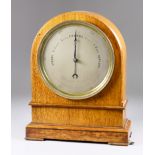 A Late Victorian Oak Cased Table Top Aneroid Barometer, by E.J. Dent of Paris, with 6.25ins diameter