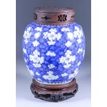 A Chinese Blue and White Porcelain Jar, 18th Century (Kangxi), painted with prunus on a cracked