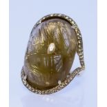 A Large Cabochon Gold Strand Rutilated Quartz Dress Ring, Modern, in 18ct gold mount set with