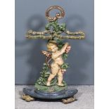 A Victorian Painted Cast Iron Umbrella Stand, the back with Cupid supporting twin rustic pattern