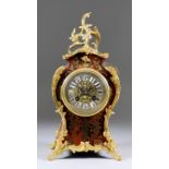 A Late 19th Century French Red Tortoiseshell, Boulle and Gilt Brass Mounted Mantel Clock of "Louis