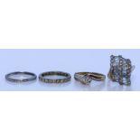 A Mixed Lot of Gem Set Rings, Modern, comprising - a diamond set twist ring, the .20ct centre