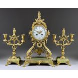 A Late 19th/Early 20th Century French Gilt Metal and Green Onyx Three-Piece Clock Garniture, the