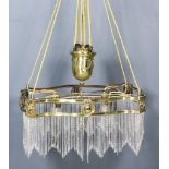An Early 20th Century Brass Framed Rectangular "Rise and Fall" Light Fitting of serpentine outline