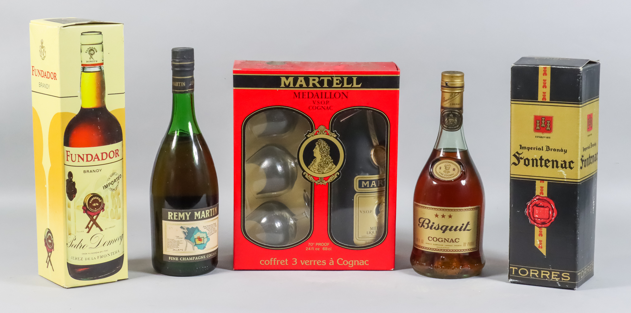Six bottles of Janneau V.S.O.P. Grand Armagnac, six bottles of Bisquit "3 Star" cognac, and six