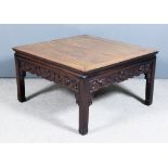 A Chinese Hardwood Square Coffee Table, with flush panelled top and moulded edges, aprons carved