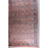 An Indian Carpet of "Tabriz" Design, Mid- 20th Century, woven in pastel colours, the field filled