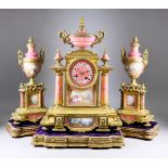 A 19th Century French Gilt Brass and Pink and Gilt Decorated Porcelain Mounted Three-Piece Clock