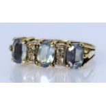 A Three Stone Aquamarine Ring, in 18ct gold mount, the three aquamarine, approximate total