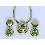 An 18ct Gold Necklace and Earrings Suite, by Boodle & Dunthorne, comprising a faceted peridot