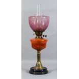 An English Veritas Oil Lamp, Late 19th Century, the orange marbled glass reservoir with gilt metal