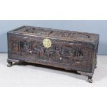 A Chinese Carved Hardwood Rectangular Blanket Chest, the lid and front carved in relief with scene