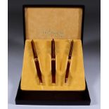 A Boxed Set of Three Writing Instruments, by Dupont of Paris, comprising - ball point pen,