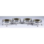 A Harlequin Set of Four George III and Victorian Silver and Silver Gilt Oval Salts, three by