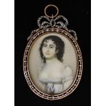I* Attributed to Jean Urbain Guérin (1761-1836) - Miniature oval portrait on ivory of a young woman,