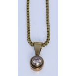 A Solitaire Diamond Pendant, Modern, in 14ct gold mount, approximate diamond weight .25ct, suspended
