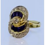 An 18ct Gold Sapphire and Diamond Cluster Ring, Modern, in the form of two interlocking rings, set