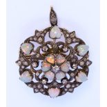 An Opal and Diamond Pendant at Will, in white and gold coloured metal mount, set with twelve small